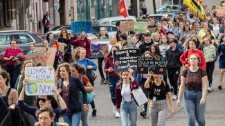 crowd of people demonstrating about climate change